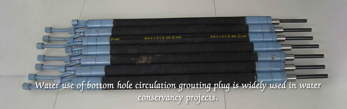 Several water use of bottom hole circulation grouting plugs are on the floor.